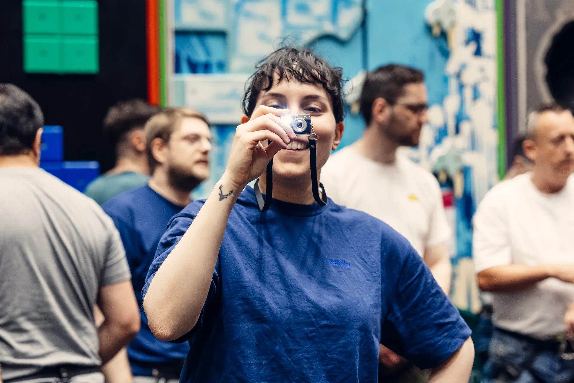 A Verda colleague taking a photo during a team gathering